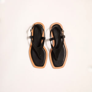 Double front view of Juniper Sandal in Black, highlighting its timeless elegance and enduring quality, designed for optimal comfort and warm weather wear.