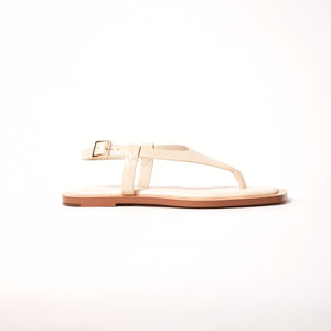 Side view of Juniper Sandal in Crema, emphasizing its gentle and secure embrace, perfect for stepping confidently into any occasion.