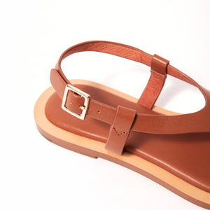 Single 3/4 view close up of Juniper Sandal in Tan, showcasing its intricate details and refined taste, designed to elevate your style with enduring quality.