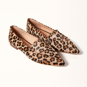 Double 3/4 view of The Poplar Pointed Flat in Leopard Calf Hair, featuring its striking leopard print calf hair material and stylish design, adding a bold statement to any outfit