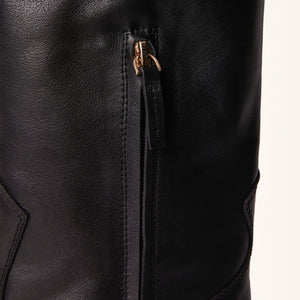 Single zip detail close up of Birch Boot in Black, focusing on the mid-way zipper for easy wear