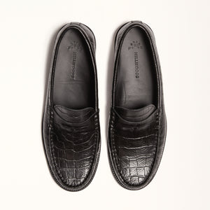 Double front view of Penny Loafer in Black Croc, showcasing the timeless design and embossed leather in a crocodile pattern for a stylish look