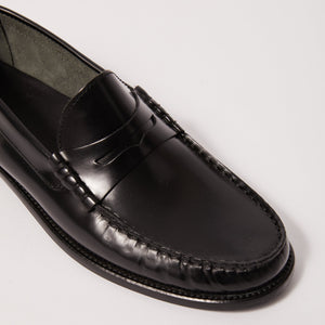 Close-up on toe view of Penny Loafer in Black, emphasizing the fine craftsmanship and detailing of the shoe
