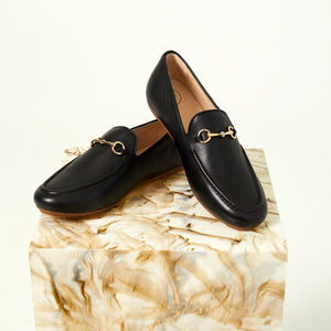 Crisscrossed Linden Loafer shoes in Black, showcasing their beautifully soft leather inner and outer