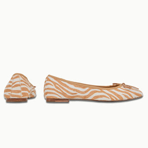 A side and back view of Banksia Ballet Flats in Brown Zebra pattern, highlighting the all-leather Calf Hair upper, added support around the heel, underfoot cushioning, and signature gum insert in the sole unit for comfort.
