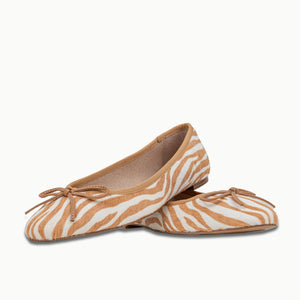 A crossed pair of Banksia Ballet Flats in Brown Zebra pattern, featuring an all-leather Calf Hair upper with added support around the heel, underfoot cushioning, and a signature gum insert in the sole unit for comfort.