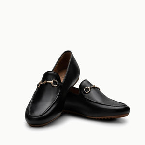 Crisscrossed Linden Loafer shoes in Black, showcasing their beautifully soft leather inner and outer, designed to naturally mold to your foot and soften with wearing, with a full gum sole for durable protection and all-day comfort cushioning