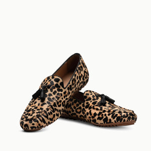 Crisscrossed Linden Loafer shoes in Leopard print, showcasing their beautifully soft leather inner and outer, designed to naturally mold to your foot and soften with wearing, with a full gum sole for durable protection and all-day comfort cushioning