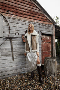 Model styling the Birch Boots in Brown leather, showcasing their timeless style and versatility