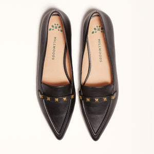 Double front view of The Poplar Pointed Flat in Black Leather with Millwoods Icon Studs, emphasizing its stylish appearance and gum sole with a rubber insert for non-slip traction