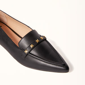 Close-up on toe view of The Poplar Pointed Flat in Black Leather with Millwoods Icon Studs, showcasing the intricate detailing and craftsmanship of the shoe