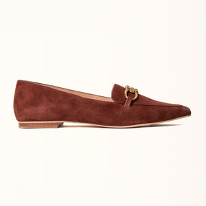 Single side view of The Poplar Pointed Flat in Brown Suede with Buckle, showcasing its refined silhouette and soft suede lining, complemented by a chic buckle detail.