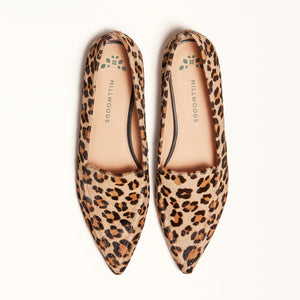 Double front view of The Poplar Pointed Flat in Leopard Calf Hair, emphasizing its eye-catching leopard print design and gum sole with a rubber insert for traction and comfort.